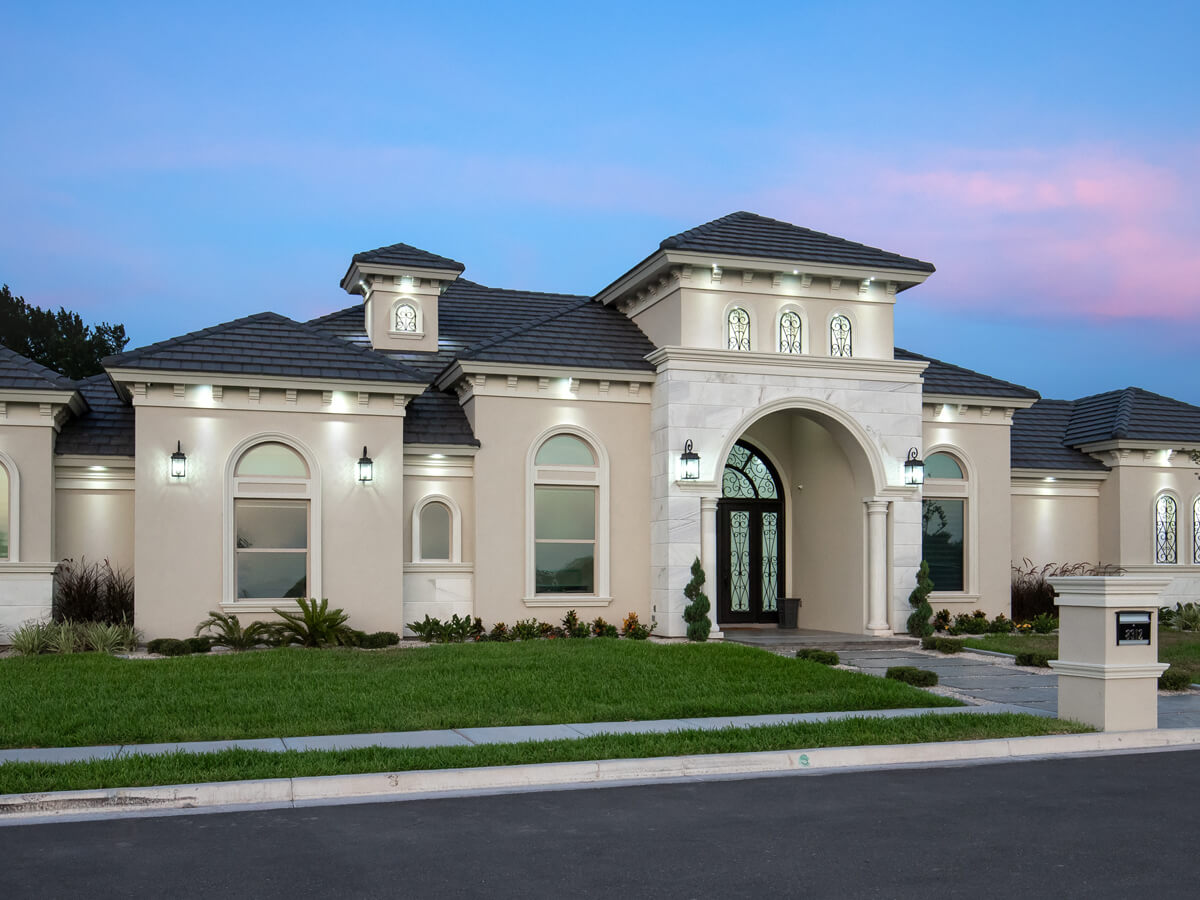 Front view of a Dolcan Homes, custom built home in McAllen, during sunset
