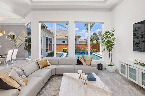 A cozy living room with a large sectional couch and a television, perfect for family entertainment and comfort.