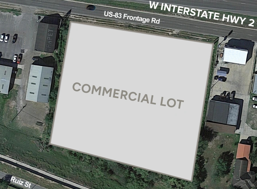 Aerial view of a vacant commercial lot labeled 